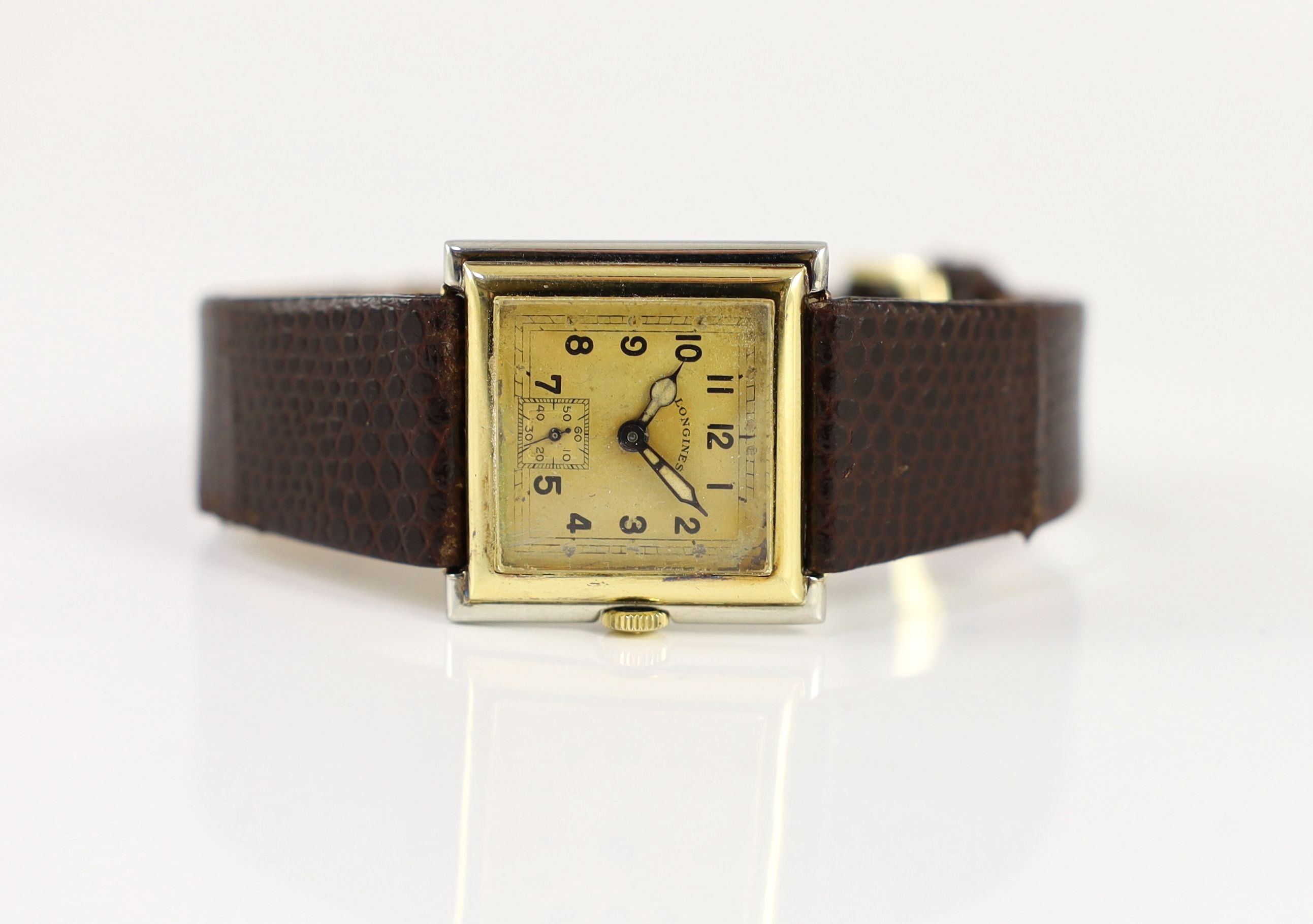 An Art Deco 18ct gold and platinum Longines manual wind square dial wrist watch